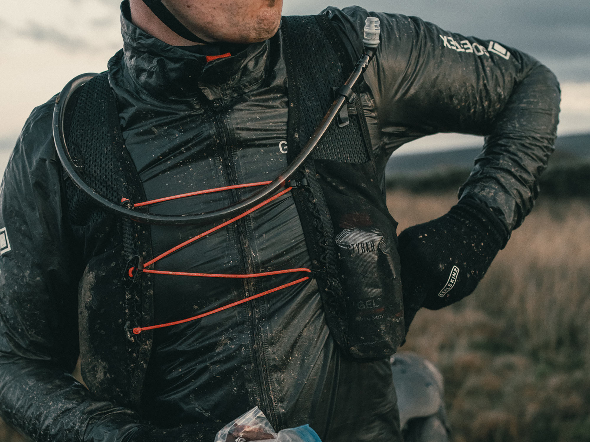 Restrap minimalist all-mesh Lightweight Race Hydration Vest, in the ran & mud