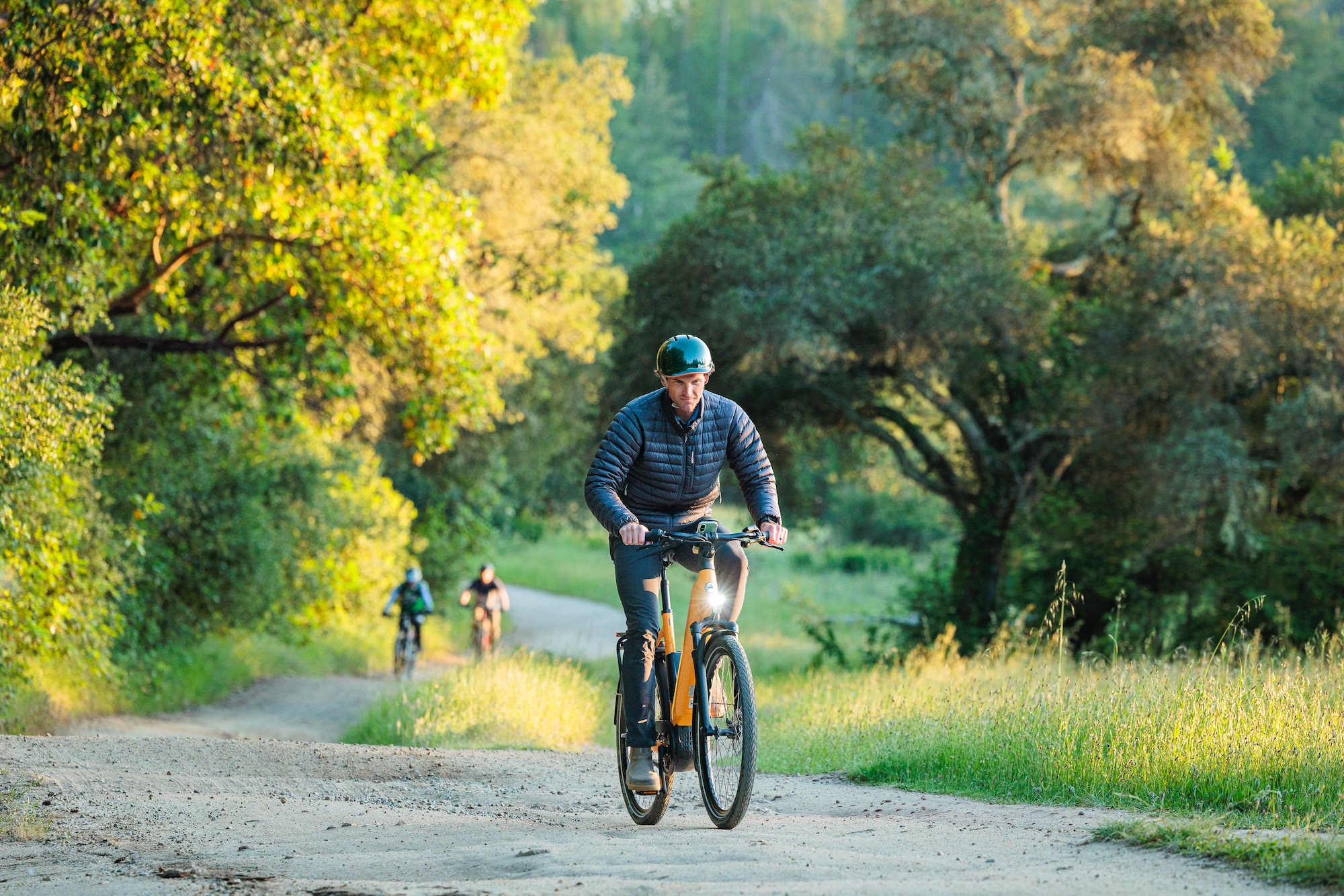 a man riding the Gazelle Ultimate 380+ 2.0 on a gravel road.