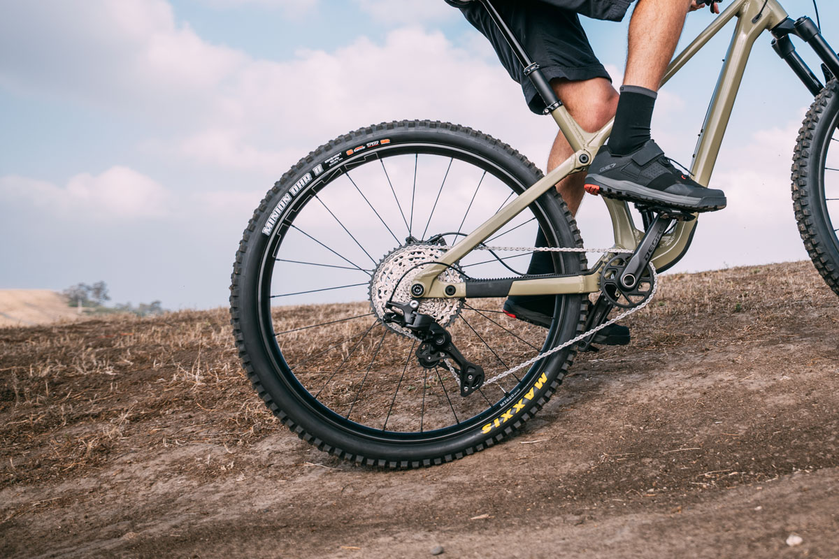 Shimano DEORE mechanical drivetrain, rider climbing