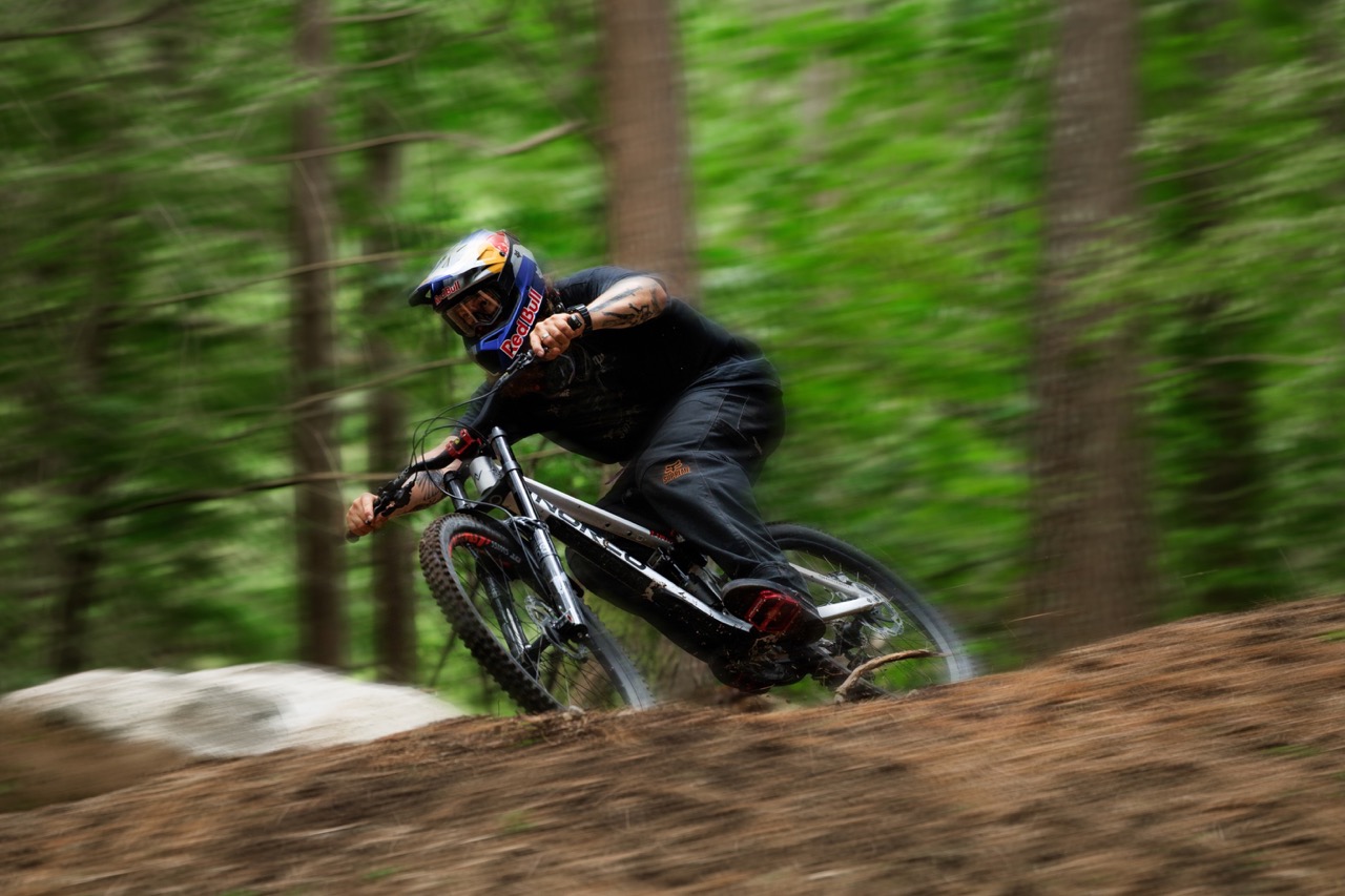 Brage Vestavik riding the Norco Torrent DH down a trail
