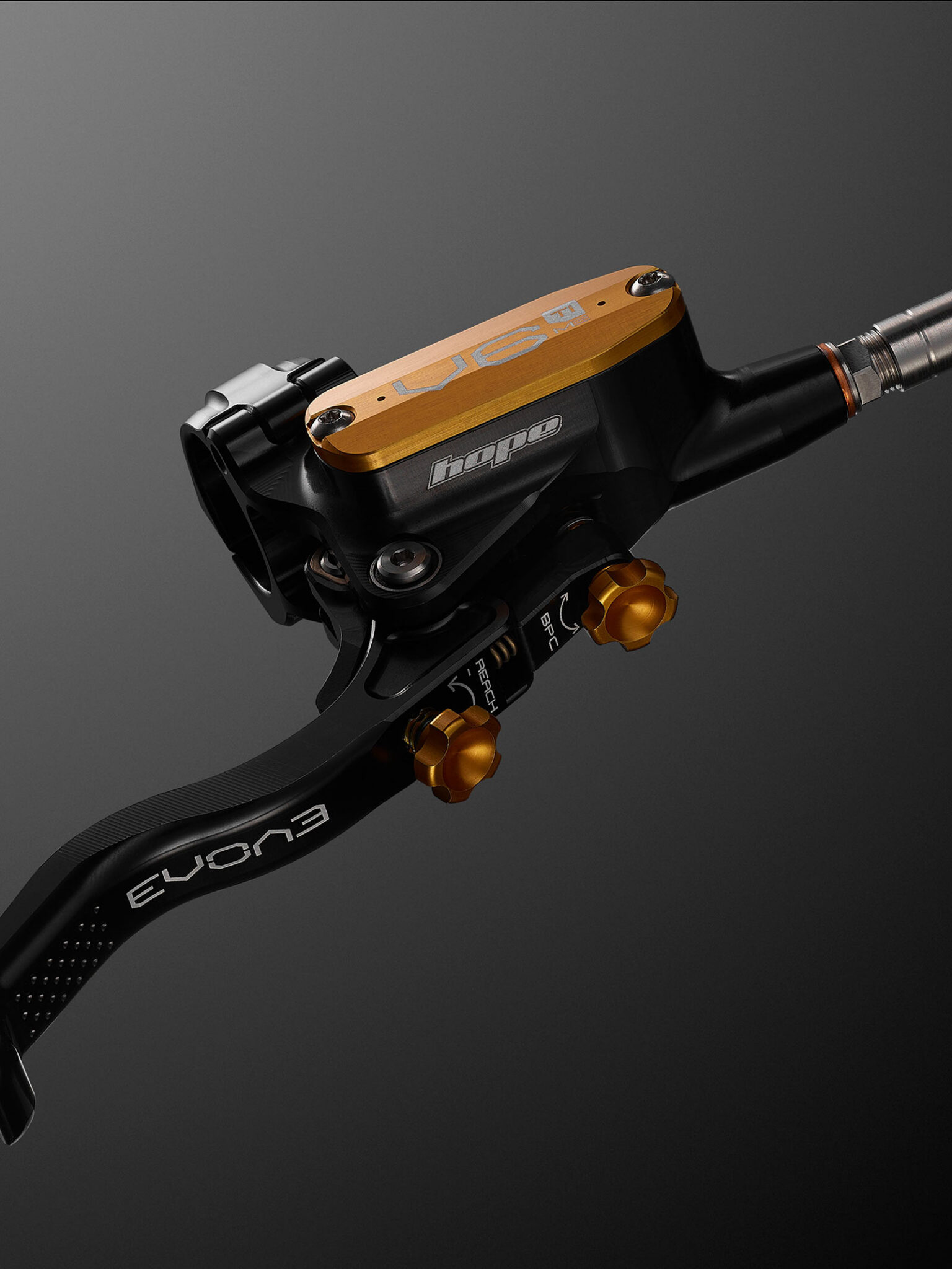 closeup detail view of hope evo v6ti mono edition mountain bike brake levers.