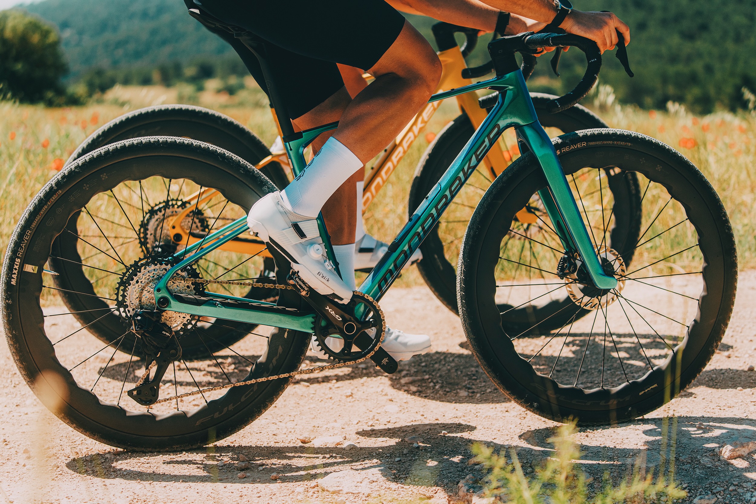 two wirder on the new Mondraker Arid bike showing the updated fork design.