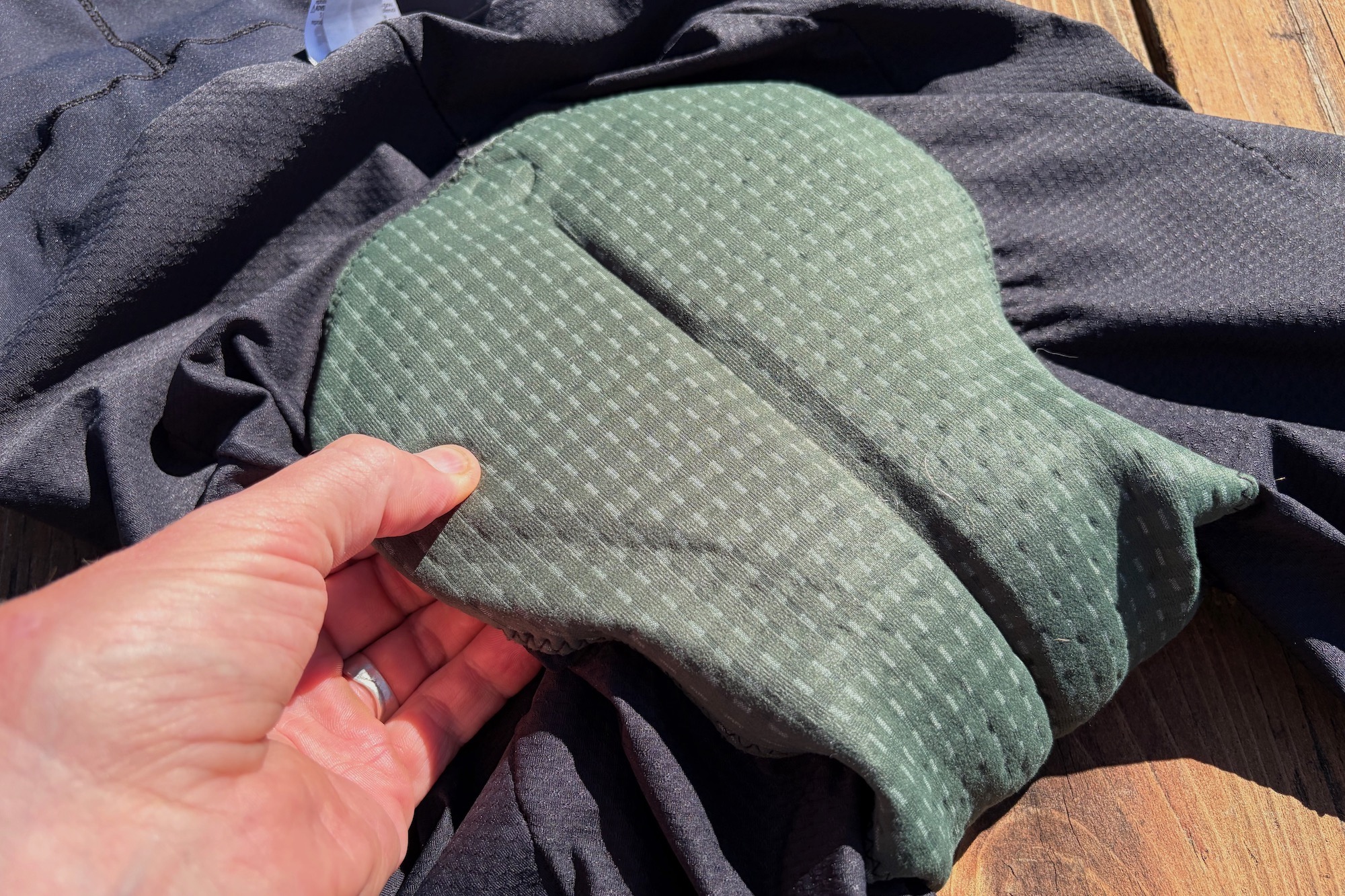 a water bottle and some other gear in the rear pockets of the Fox Tecbase liner bibs.