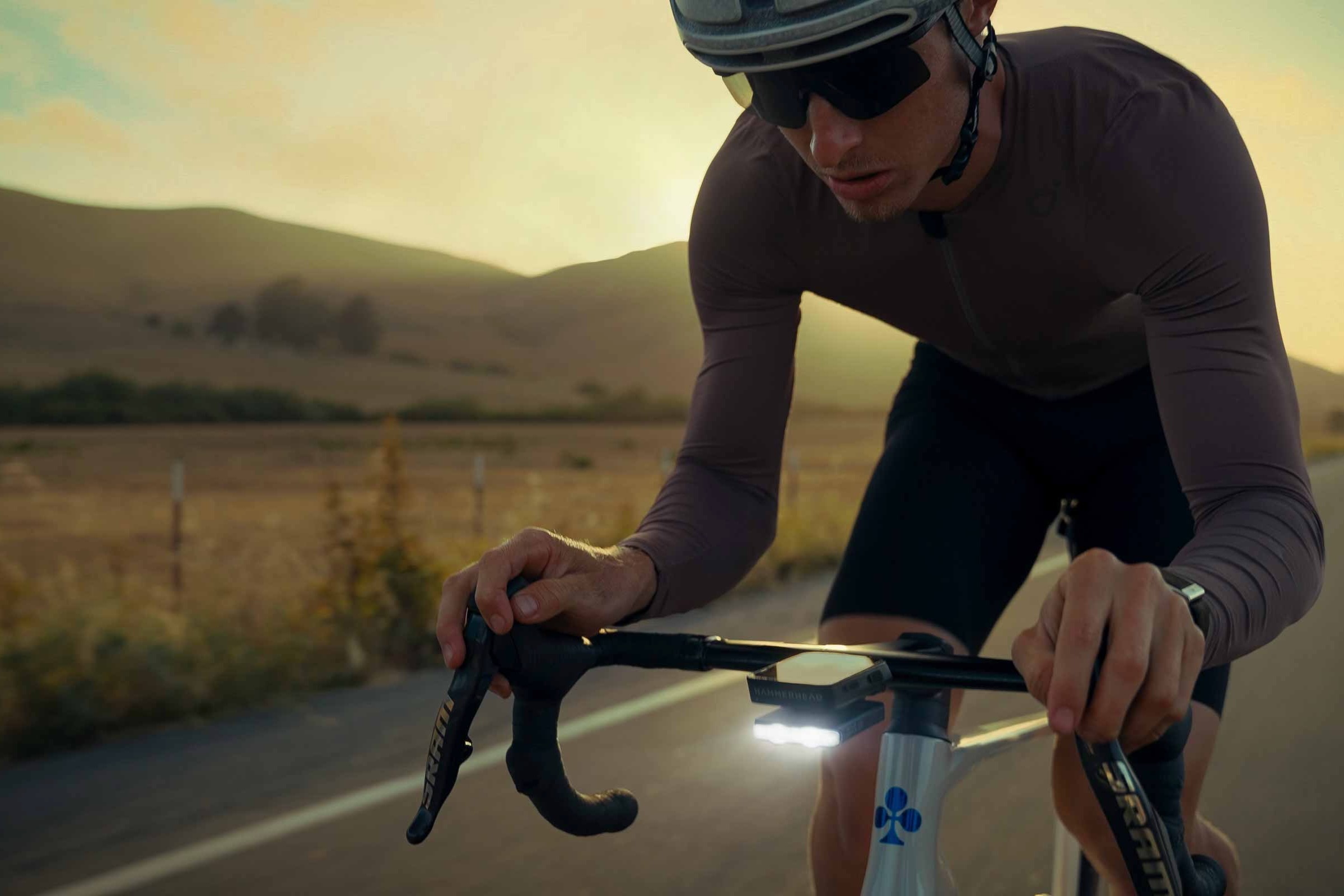 a man road riding at dusk with the Lezyne Road Drive 500 light