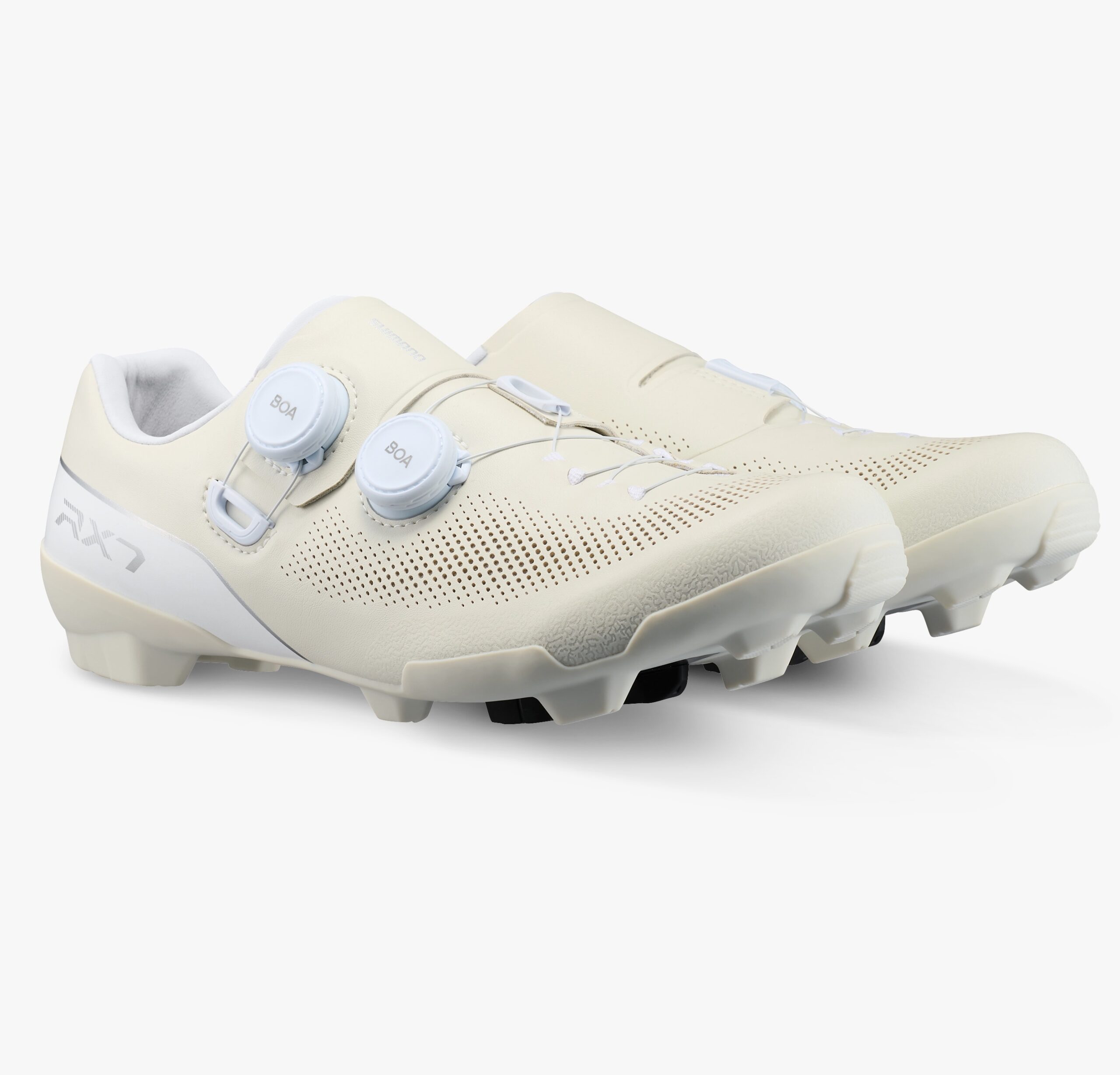 studio image of the pair of Shimano RX710 gravel shoes in white, viewed from the front angle