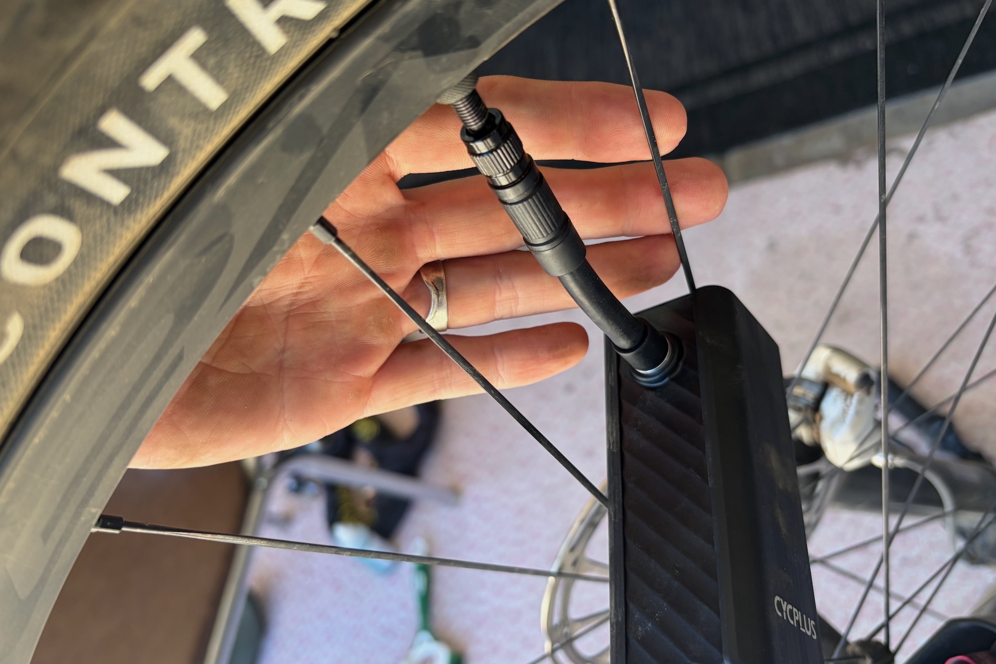 the extension hose on the Cycplus A3 Mini attached to a valve